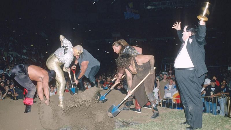 Four people in this picture (if you count The Undertaker down in the grave) would win the World Title at some point. That's wild!